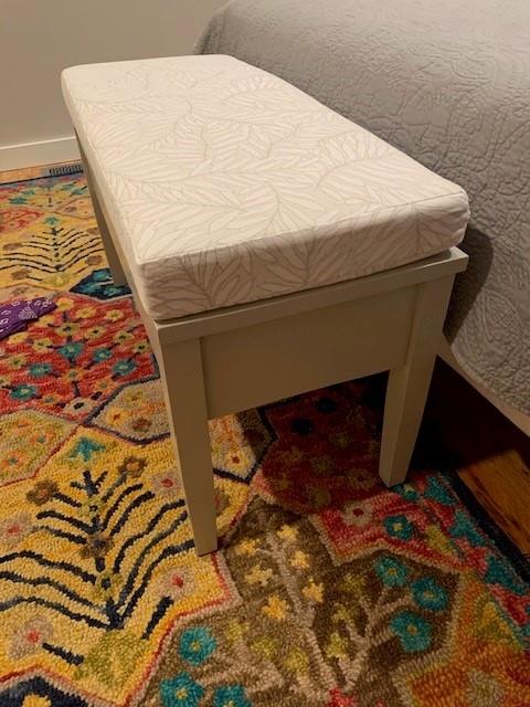 Bottom of bed, on a piano bench ❤️