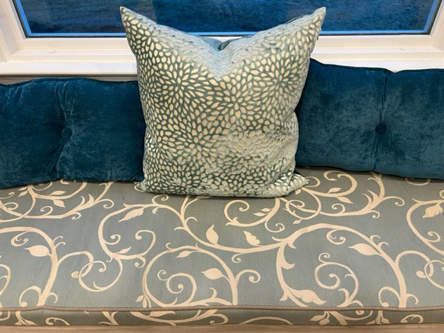 Window Bay Cushion - Trapezoid
DIMENSIONS	96″-57″ Wide  x  21″ Deep  x  2″ Thick
STRUCTURE	Boxed Edge
FABRIC	Sunbrella Cabaret Blue Haze (45099-0003)
TRIMMING	Double Welt
Heritage Alpaca (18000-0000)
FILLING	Polyurethane Foam
With Fiber Batting
TIES	No ties