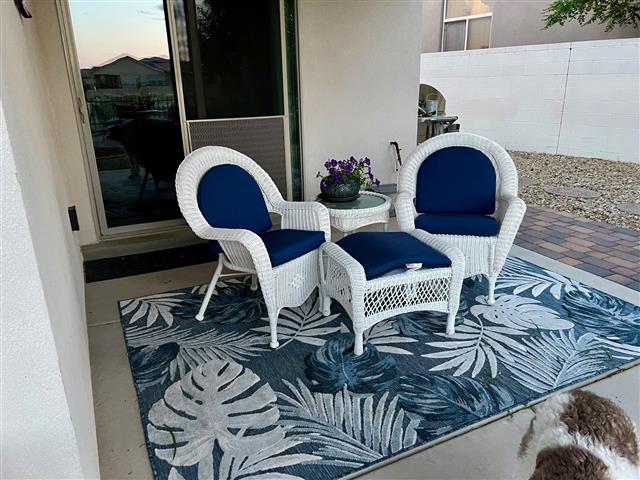 Custom ottoman, seat, and back cushions set in boxed and waterfall constructions with Sunbrella Echo Midnight fabric, polyurethane foam with fiber batting, no ties