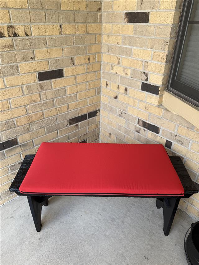 1 custom bench cushion - square corners - set in waterfall construction with Sunbrella Logo Red fabric and single welt Black trimming, polyurethane foam with fiber batting, no ties