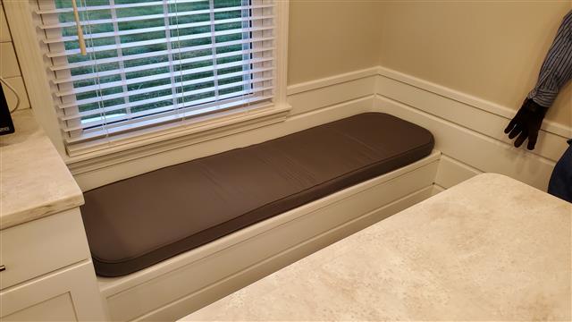 1 custom bench cushion - slightly rounded corners - set in boxed construction with Sunbrella Charcoal fabric and trimming, polyurethane foam with fiber batting, no ties