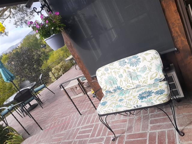 2 custom bench cushions - rounded corners - slightly rounded corners - set in boxed construction with Sunbrella Violetta Baltic fabric and trimming, polyurethane foam with fiber batting, 2 ties at back corners