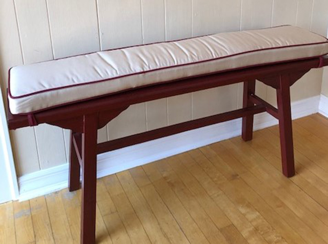 Boxed bench cushion made in Antique Beige fabric with Burgundy Trim with Burgundy ties