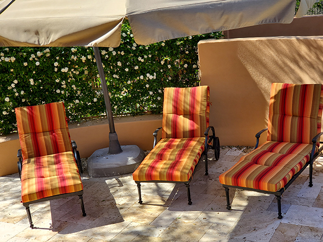 3 custom chaise cushions with tufted square corners made in Sunbrella Astoria Sunset Fabric.